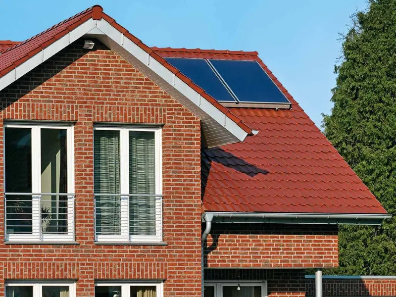 Brick house with white Schueco CT 70 windows
