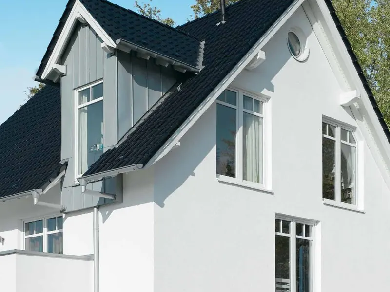 White house with Schueco CT 70 tilt and turn windows