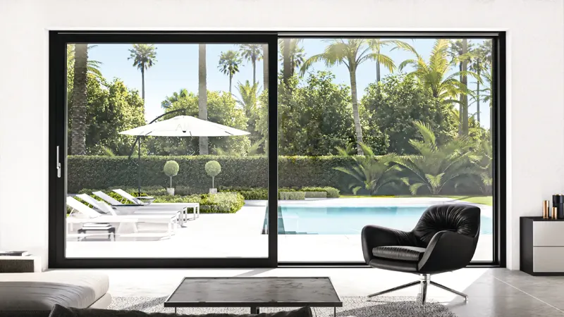 Two-panel dark-framed uPVC sliding door looking out to a pool