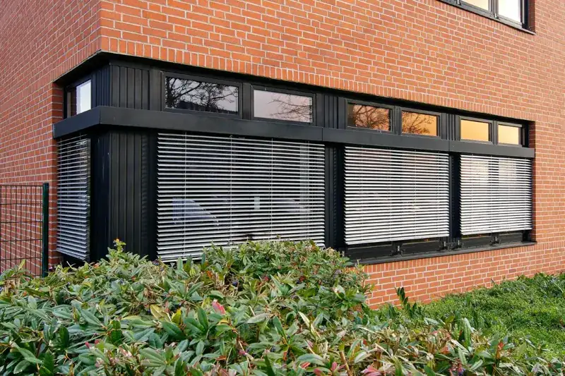 Black uPVC window frames on a brick facade
